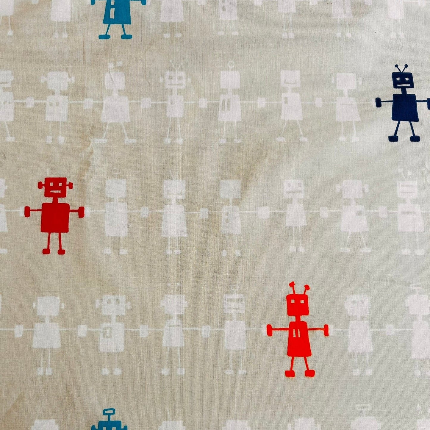 Reggie Robot Fabric by Scion in Cream